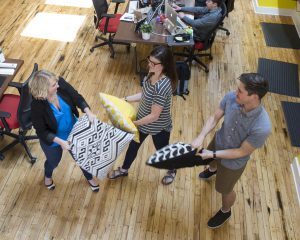 Lemonly interns socializing in office