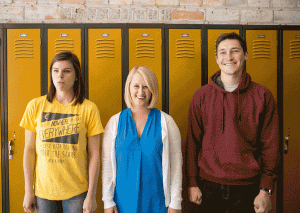 lemonly interns making silly faces next to lockers